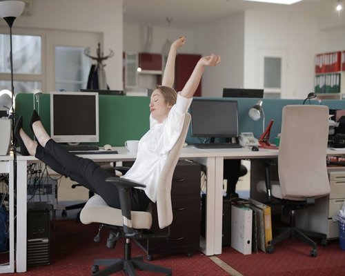 Woman stretching arms during a work break